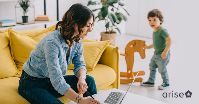 Woman in front of a computer working from home.